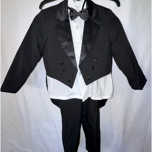 Tuxedo w/tails. Includes; jacket, shirt, tie, pants & cummerbund. Kid size 6